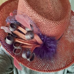 Something special red straw hat with purple embellishment